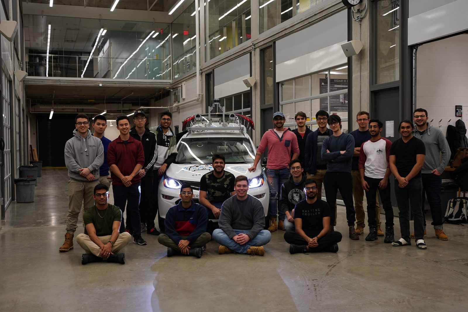 WATonomous autonomous vehicle team with their self-driving car at the University of Waterloo